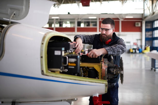 a man who is from aerospace industry repairing aerospace.